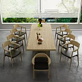 Wooden Dining Table Set With Eight Chairs Black Cushions Vase Decorations And Green Plants
