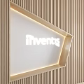 Wooden Background Wall with Vertical Stripes and Triangular Illuminated Section Featuring iInvents Logo 3d model