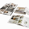 Open Interior Design Books Showcasing Modern Room Interiors And Furniture