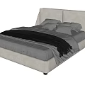 Modern Upholstered Double Bed With Soft Pillows And Cozy Gray Blanket