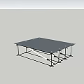 Modern Minimalist Glass Top Coffee Table with Metal Frame and Sand Pile in Indoor Setting