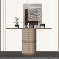 Stylish Console Table With Woven Base Wooden Top And Decorative Items Near Wall Art