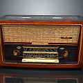 Vintage Electronic Radio With Wooden Case And Classic Tuning Knobs