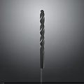 Metal Drill Bit with Spiral Flutes and Sharp Tip Standing Upright on Dark Background