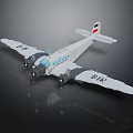 White Model Airplane With Dual Propellers And UAE Flag On Tail Wing