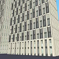 Modern Office Building Exterior Featuring Two Tall Structures With Regular Window Arrangement And Blue Sky