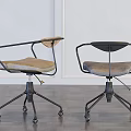 Two Modern Office Chairs with Black Armrests Padded Seats and Swivel Bases