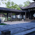 Rockery Stones In Chinese Classical Courtyard With Pond And Green Trees