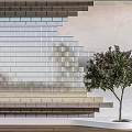 Layered Multicolored Brick Room Divider With Potted Tree And Wooden Floor