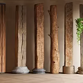 Wooden Pillars With Various Textures Different Bases And A Green Plant In Indoor Decor