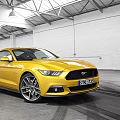 Yellow Ford Mustang Sports Car Parked In Modern Indoor Garage With Tire Tracks