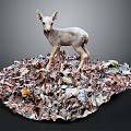 Fawn Standing On A Pile Of Various Colored Leaves In Natural Environment