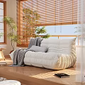 Cozy White Lazy Sofa With Quilted Design In Bright Room With Wooden Blinds And Plants