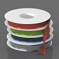 Colorful Ribbon Spools Stacked With Shiny Red Green Blue And Gray Rolls