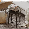 Modern Round Side Table With Stacked Books And Wicker Basket Near Bed On Patterned Rug