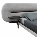 Modern Upholstered Double Bed with Curved Grey Headboard and Black Side Table