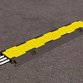 Industrial Cable Protection Equipment Yellow And Gray Design With Extended Cables On Asphalt Surface