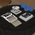 Open Books and Magazines on Dark Wooden Table with White Bowl and Blue Hydrangeas