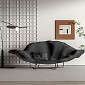 Black Leaf Shaped Chaise Lounge With Floor Lamp Grid Patterned Wall Painting And Green Plant