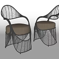 Stylish Black Rattan Leisure Chairs With Curved Design And Beige Cushions