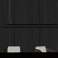 Modern Linear Pendant Light In Dining Room Interior With Dark Wood Wall And Chairs