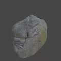 Gray Stone Frog Sculpture With Textured Surface And Yellow Spots On Natural Rock
