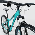Teal Mountain Bicycle With Sturdy Frame Large Tires And Front Suspension Fork