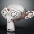 Gray Monkey Head Sculpture With Large Eyes Prominent Nose And Ears