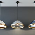 Three Modern Pendant Lights with Different Colored Dome Shades and Metallic Accents Hanging from Ceiling