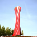 Red Twisted Tall Tower Design Surrounded by Trees Under Blue Sky