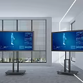 Modern TVs with Blue Screens on Wheeled Stands in Contemporary Interior with Blinds and Windows