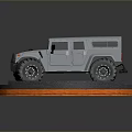Silver Off Road Vehicle Model On Cobblestone Base With Orange Edge Lighting