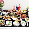 Various Chinese Dishes with Drinks and Fresh Flowers on Dining Table