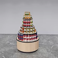 Modern Circular Multi Tiered Display Shelf With Wooden Base Displaying Canned Goods