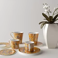 Elegant Tea Set Featuring Patterned Yellow And White Cups Saucers White Vase White Orchids 3d model