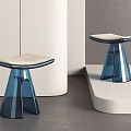 Modern Stools with Transparent Blue Base and Light Colored Seat Cushion in Minimalist Interior Setting
