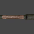 Vintage Military Weapon Featuring Cylindrical Metal Top And Wooden Handle Design