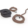 Household Flexible Rubber Hoses in Black and Brown Coiled Curved Shapes for Daily Use