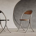 Modern Dining Chairs With Curved Metal Frame And Wooden Seat In Sleek Contemporary Design