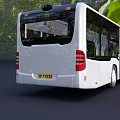 White Modern City Bus With Open Doors And Green Tree Surroundings