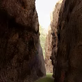 Natural Garden Landscape With Towering Rock Walls Narrow Passage And Sunlight