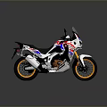 Adventure Motorcycle With Red White Blue Body Gold Wheels Windshield And Black Seat