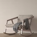 Cozy Light Gray Rocking Chair With Plaid Blanket On Armrest Wooden Floor And Light Wall