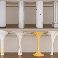 Modern Decorative Columns With Textured Surfaces Various Designs And Colors Displayed On Shelves