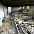 Abandoned Pigsty Interior With Dilapidated Structure Hay Debris And Wooden Fences