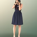 A Woman In Dark Blue Dress Wearing Black Gloves Standing Against Green Gradient Background