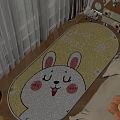 Cozy Bedroom Interior With Yellow Rabbit Design Rug And LUCK BEGINS Text