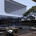 Modern Sales Office Building With White Glass Facade Perforated Grilles And Landscaped Entrance