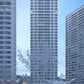 Modern High Rise Residential Building Exterior With Balconies And Green Trees In Urban Area