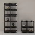 Black Multi Tiered Storage Shelves With Decorative Stones And Minimalist Design